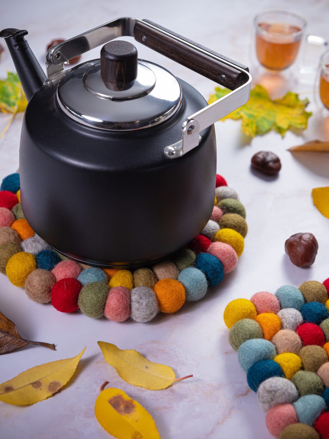 Colorful wool trivet with autumn table setting
