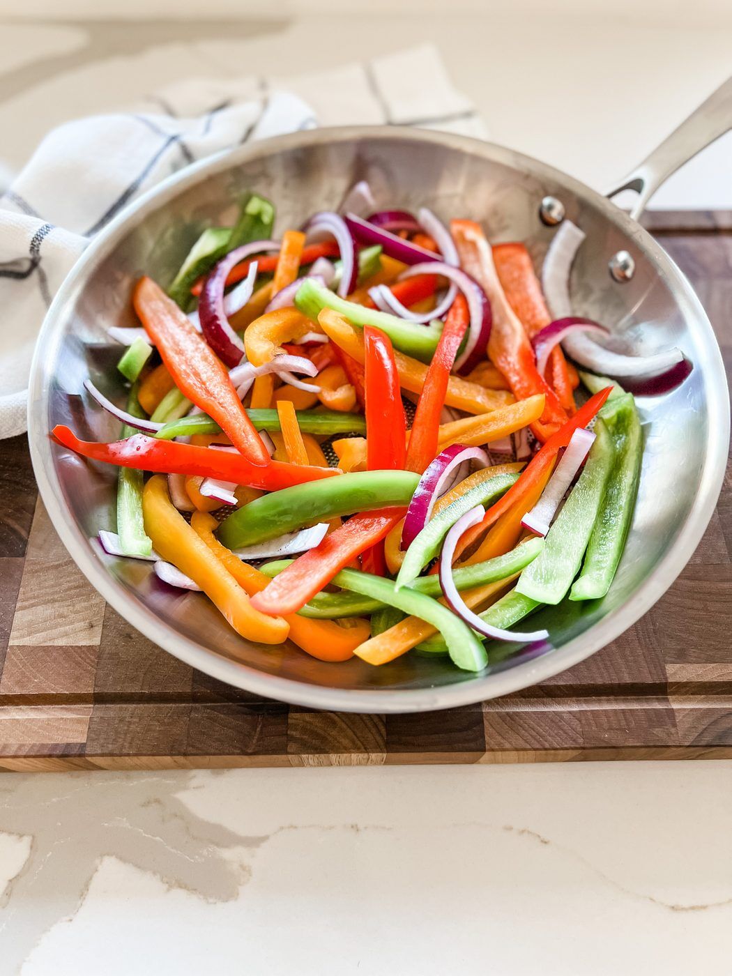 TitaniumMAX fry pan with fresh peppers and onions