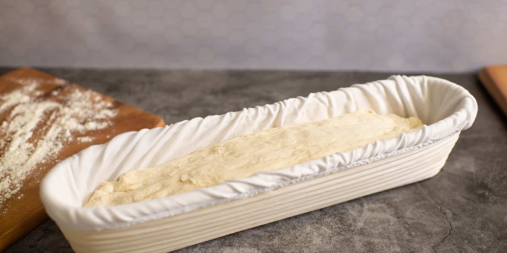 Dough proofing in a natural cane Brotform